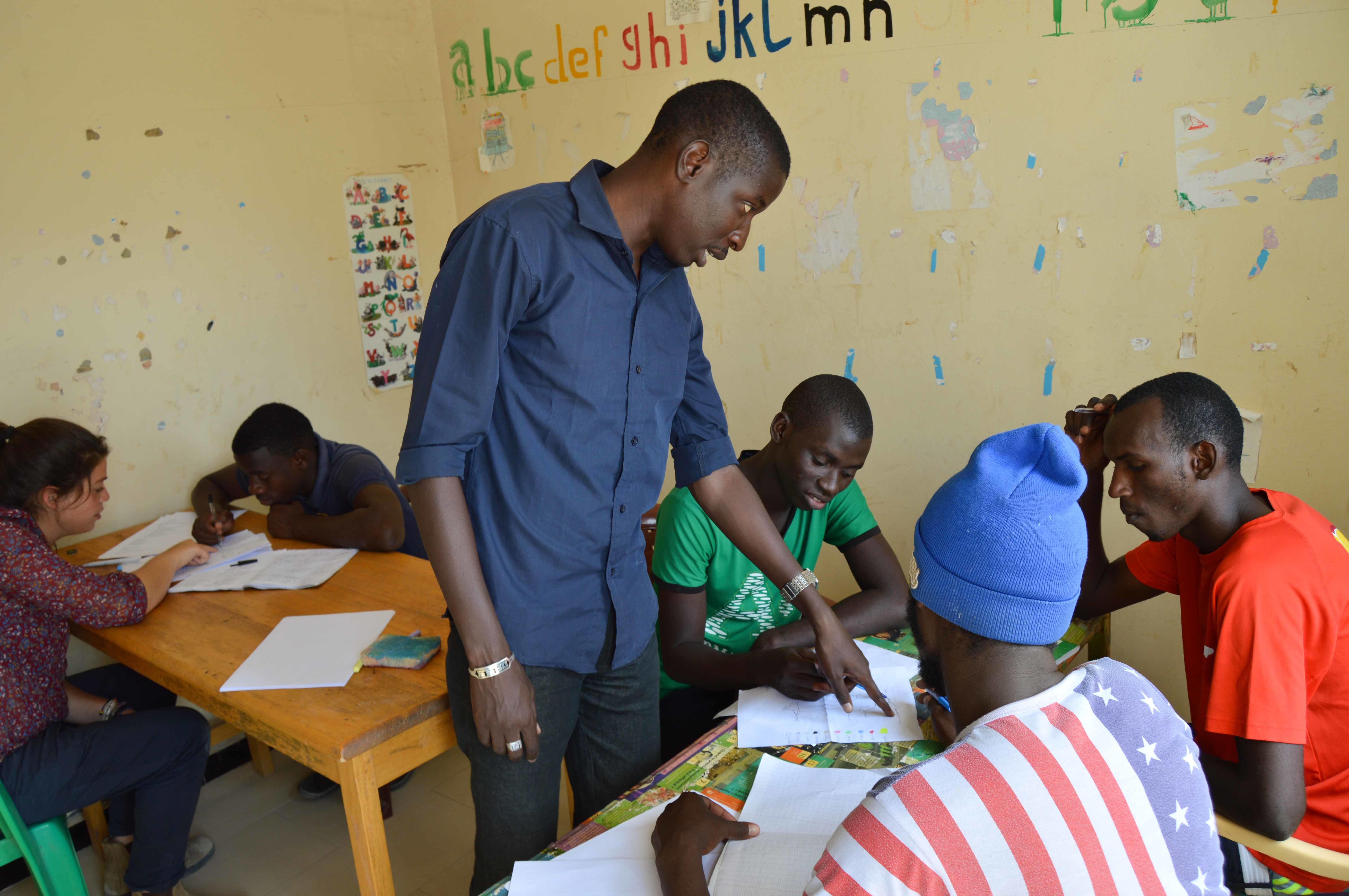 A Projects Abroad intern works with local community members as part of his micro-finance work experience in Senegal. An intern works with members of a local community during his Micro-finance internship in Senegal.
